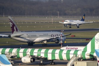 Düsseldorf Airport, Qatar Airways Boeing 787 Dreamliner, Eurowings aircraft on the apron, taxiway,