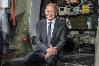 German Chancellor Olaf Scholz sits in a Bundeswehr NH90 helicopter, International Aerospace