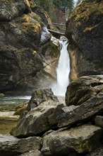 The lower part of the Buchenegg waterfalls, surrounded by rocks. Autumn. Oberstaufen, Upper Allgäu,