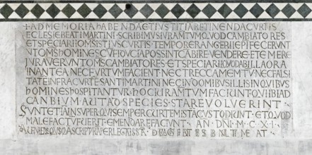 Medieval inscription for the money changers' guild, Romanesque, main façade, cathedral, Cattedrale