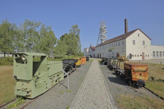 Rail vehicles Locomotive, lorries and dump truck with winding tower at the former mine Reiche Zeche