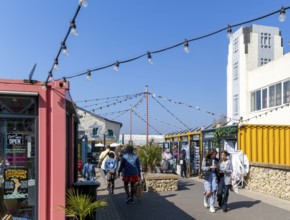 Shops and cafes in converted shipping containers, Beach Street, Felixstowe, Suffolk, England, UK