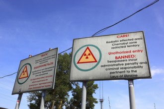 Chernobyl and Pripyat exclusion zone, sign indicating the contaminated zone, at the access road