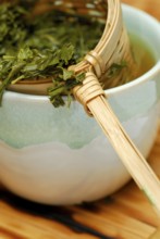 Cup and bamboo strainer with Sencha tea, green tea, green tea, tea strainer, brewed