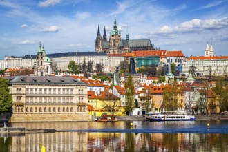 View of and Gradchany Prague Castle and St. Vitus Cathedral over Vltava river