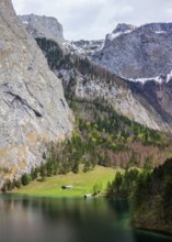 Farm house on mountain lake Obersee lake in Alps mountains. Bavaria, Germany, Europe