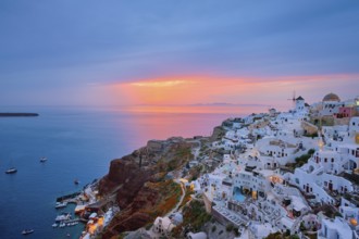 Famous greek iconic selfie spot tourist destination Oia village with traditional white houses and