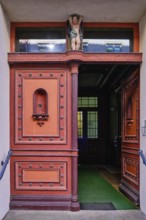 Artfully designed and crafted front door of the listed building Badenstraße 15, UNESCO World