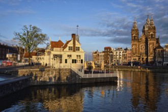 AMSTERDAM, NETHERLANDS, MAY 9, 2017: Tourist information center, Amsterdam canal and Church of