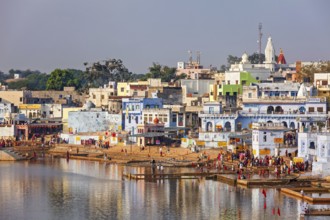 PUSHKAR, INDIA, NOVEMBER 20, 2012: Hindu devotees pilgrims bathing in sacred Puskhar lake (Sagar)