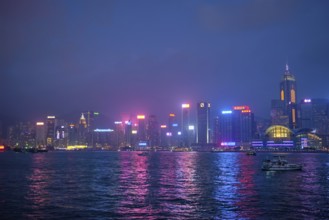 HONG KONG, CHINA, APRIL 28, 2018: Hong Kong skyline cityscape downtown skyscrapers over Victoria