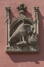 House sign, relief, eagle feeding its young in the nest, Bergstr. 13 ud 15, Nuremberg, Middle