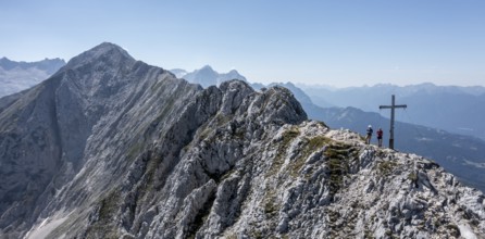 Aerial view, Alpine panorama, hikers at the summit cross, Westliche Wettersteinspitze, Wetterstein