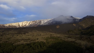 Snow-capped mountainsides, lava fields, morning light, Etna, volcano, Eastern Sicily, Sicily,