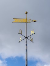 Metal wind arrow and wind chime for indicating cardinal points, north, south, east, west, Germany,