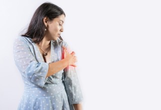 Woman with pain touching shoulder isolated. People with shoulder pain and tension on white