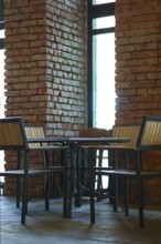 Small table with chairs around it in grunge bar