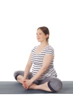 Pregnancy yoga exercise, pregnant woman doing asana Baddha Konasana Bound Angle Pose isolated on