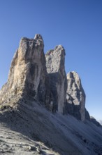 North face of the Tre Cime di Lavaredo, Drei Zinnen, three distinctive mountain peaks at sunrise in