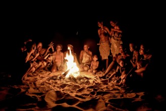 Bushmen of the Ju/' Hoansi-San sitting at the campfire, village //Xa/oba, near Tsumkwe,