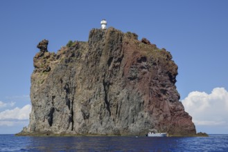 Rock island Strombolicchio with lighthouse, near island Stromboli, Lipari Islands, Tyrrhenian Sea,