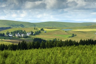 Village of la Godivelle and his lake, Cezallier plateau in the Auvergne volcanoes regional natural