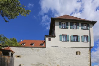 Gomaringen Castle, curtain wall, windows, green shutters, former parish seat of Johann Ulrich