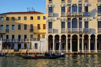 VENICE, ITALY, JUNE 27, 2018: Grand Canal with boats and gondolas on sunset, Venice, Italy, Europe