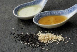 White Sesame (Sesamum indicum) and black, oil, spoon