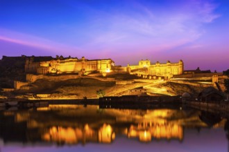 Indian landmark, Amer Fort (Amber Fort) illuminated at night, one of principal attractions in