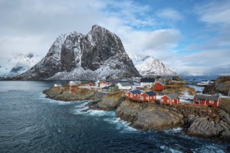 Hamnoy fishing village with red rorbu houses in Norwegian fjord in winter. Lofoten Islands, Norway,