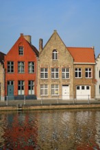 Typical Belgian cityscape Europe tourism concept, canal and old houses on sunset. Bruges (Brugge),