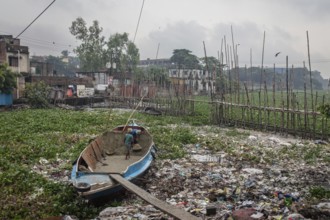 Construction workers transporting sand from a boat over a plank, Tel Ghat, Dhaka, Bangladesh, Asia