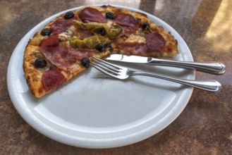 A half-eaten pizza salami, Bavaria, Germany, Europe