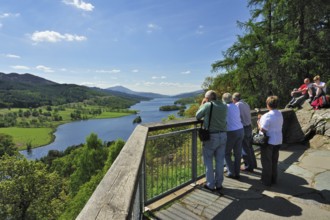 Tourists looking over Loch Tummel from Queens 's View near Pitlochry in Perth and Kinross,