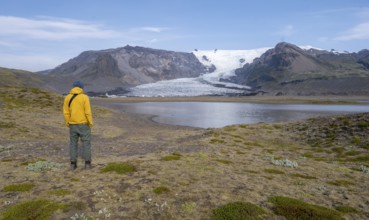 Tourist at the lake, glacier lagoon at the glacier tongue Kvíárjöku, Vatnajökull, Iceland, Europe