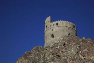 Old watchtower above the old town of Mutrah, Muscat, Oman, Asia