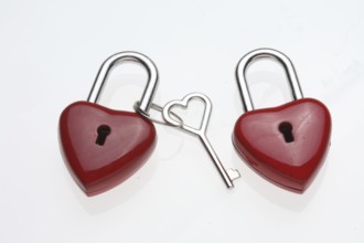 Small red padlocks with a heart-shaped key