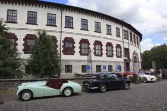 Vintage car parade in front of the castle, round building of Elisabethenburg Castle, Meiningen,