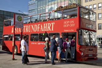 People boarding the red double-decker city tour bus, Hamburg, Germany, Europe