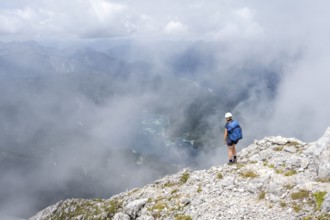 Mountaineer on the Waxenstein with fog, Wetterstein Mountains, Garmisch-Patenkirchen, Bavaria,