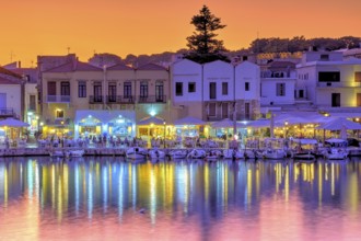 Venetian harbour, dusk, night shots, orange sky, colourful rows of houses, boats, water reflection,