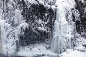 Iced and snow-covered rock face, at Godafoss waterfall, Northern Iceland Eyestra, Iceland, Europe