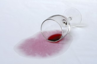 Red wine stain, overturned red wine glass on fabric, stain