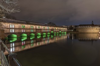 The Vauban dam illuminated at night during Christmas. Strasbourg. Bas-Rhin, Alsace, Grand Est,