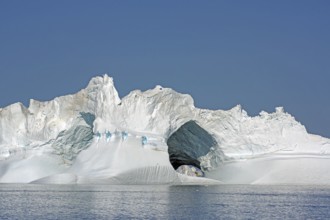 Iceberg with large ice cave, Ilulissat, Disko Bay, Denmark, Greenland, North America