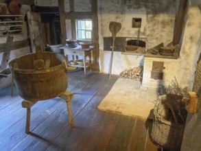 View into historical kitchen left old washing tub wooden tub back recessed in wall oven for baking