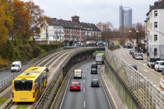 Motorway A40, Ruhrschnellweg, skyline of the city centre of Essen, exit Essen-Huttrop, track bus