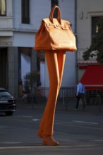 The bronze sculpture Walking Bag by Erwin Wurms at the entrance of the urban shopping zone, Bonn,