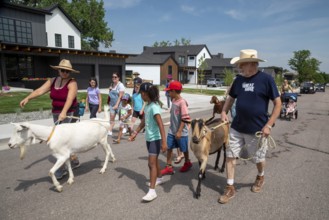 Wheat Ridge, Colorado, Accompanied by admiring children and adults, goats from 5 Fridges Farm